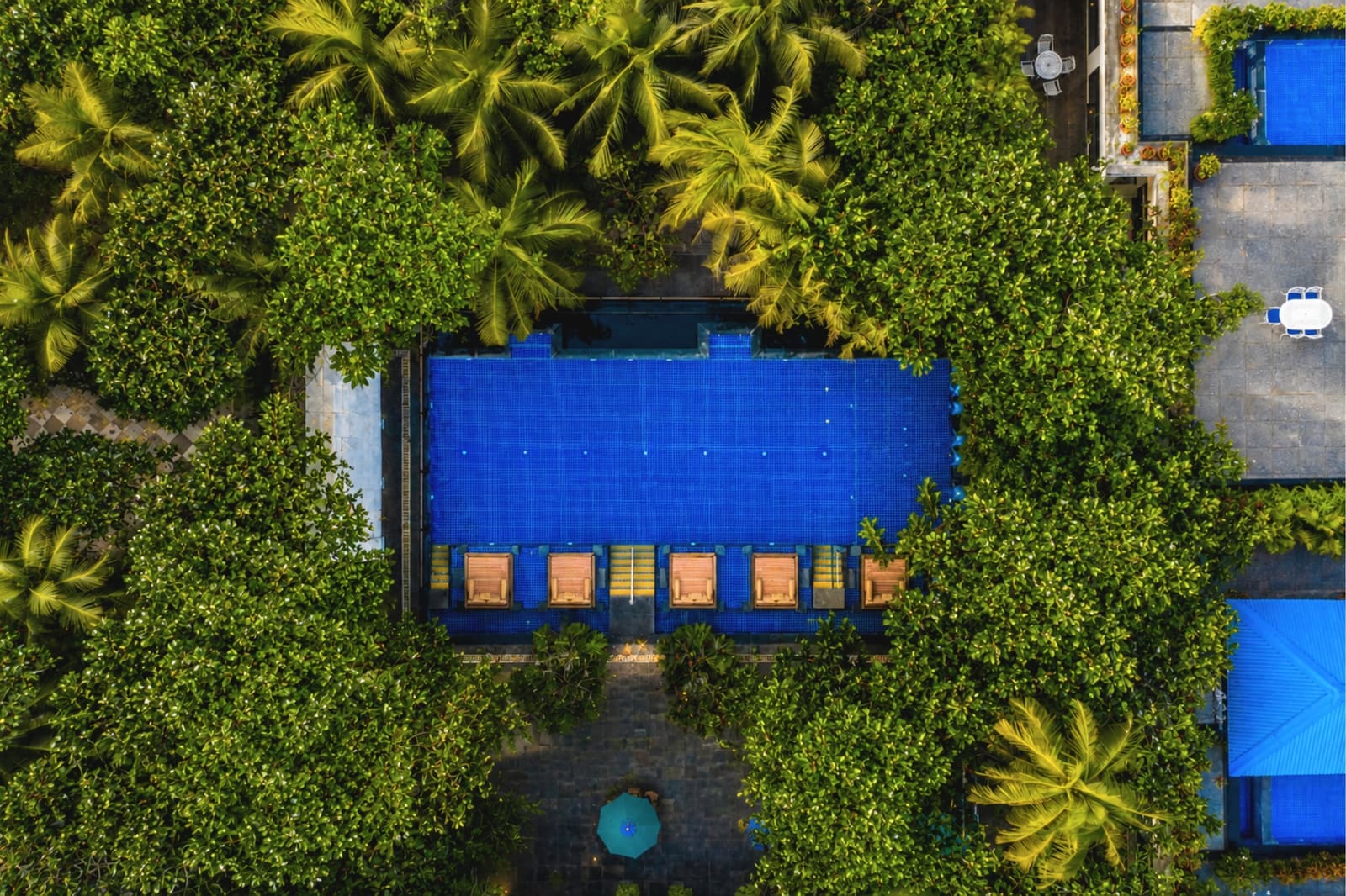 The outdoor swimming pool at a MAYFAIR resort