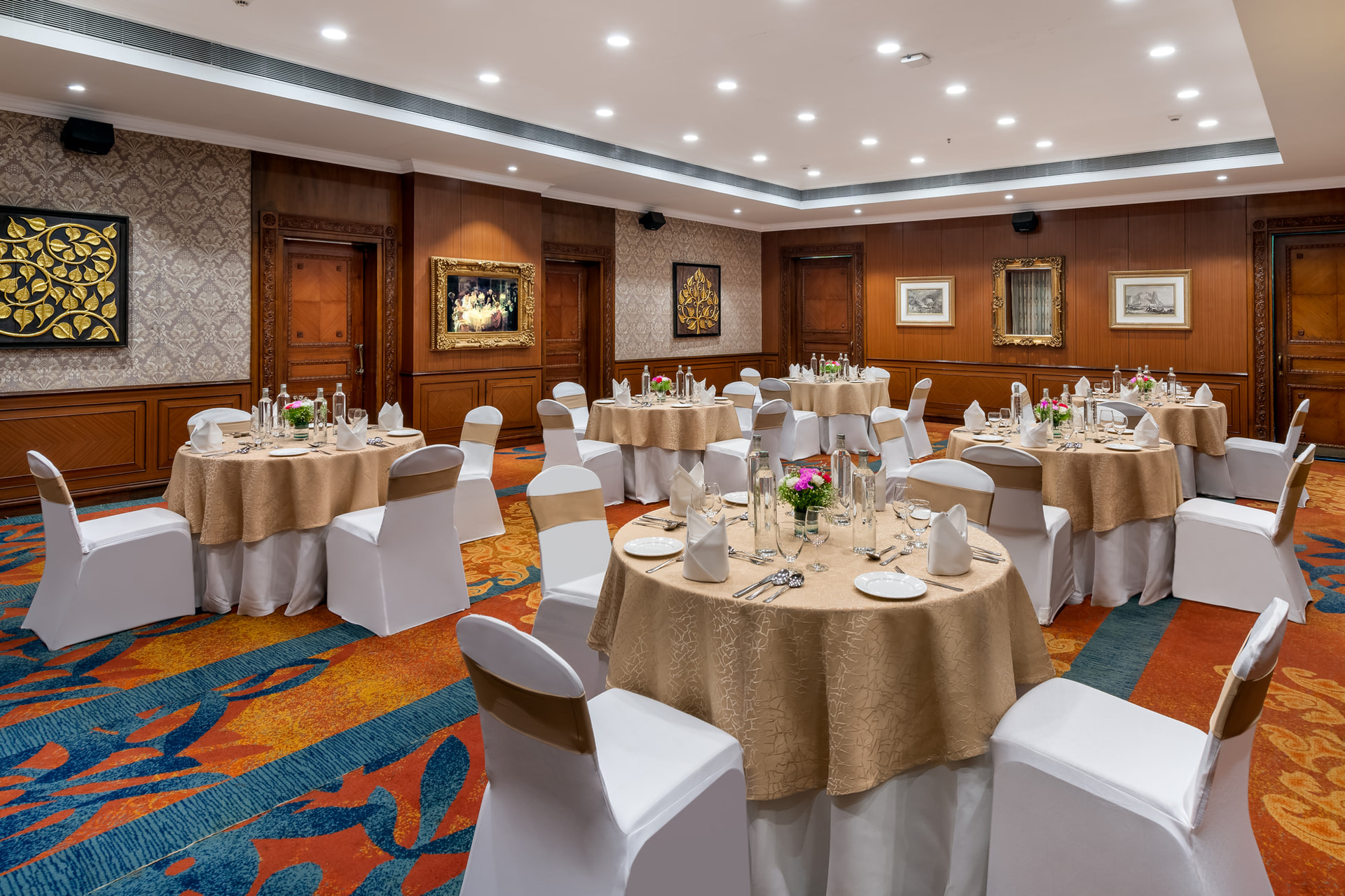 A MAYFAIR banquet hall laid with round tables for a dinner
