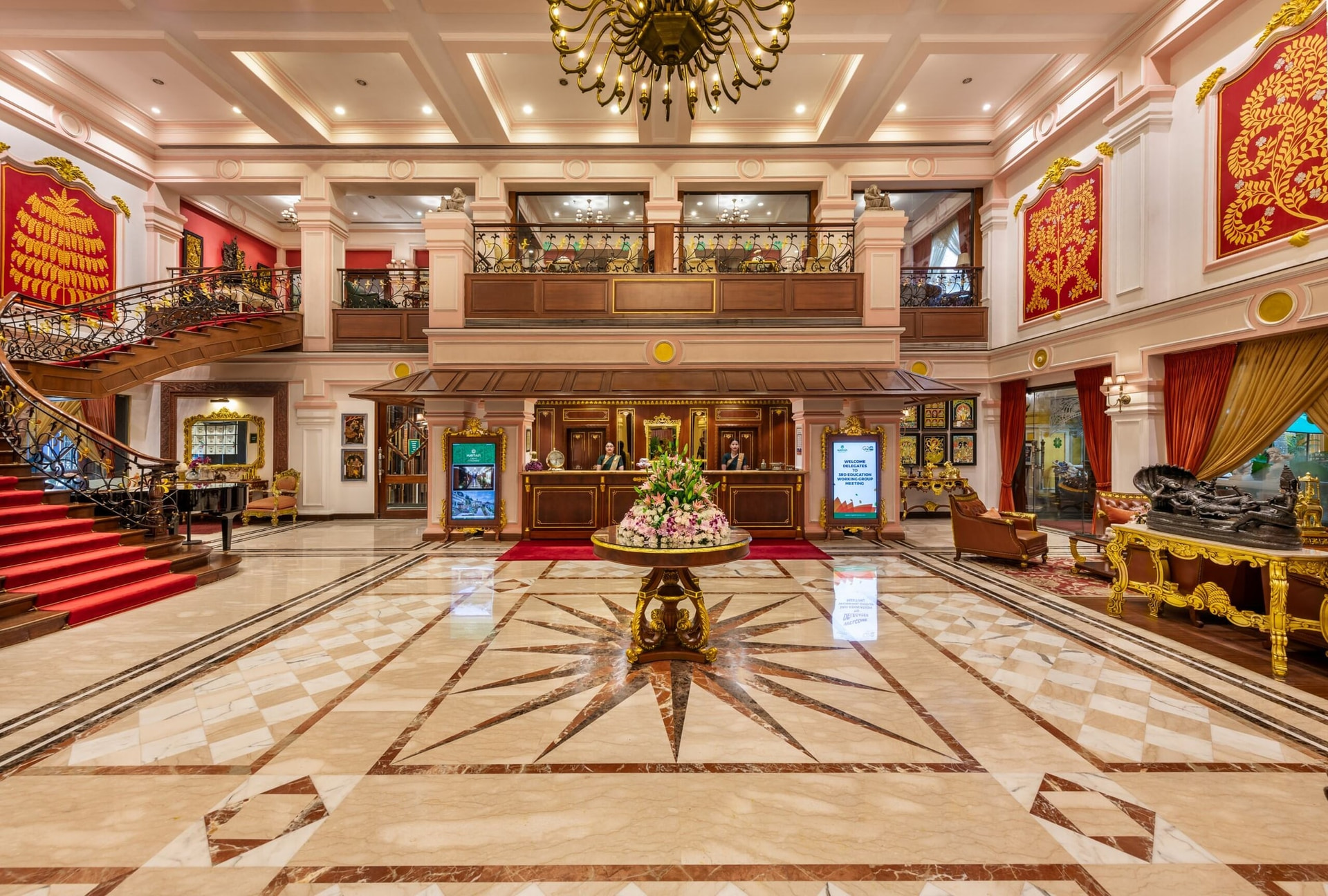 The lobby at MAYFAIR Lagoon, Bhubaneswar, with the reception desk beneath the mezzanine