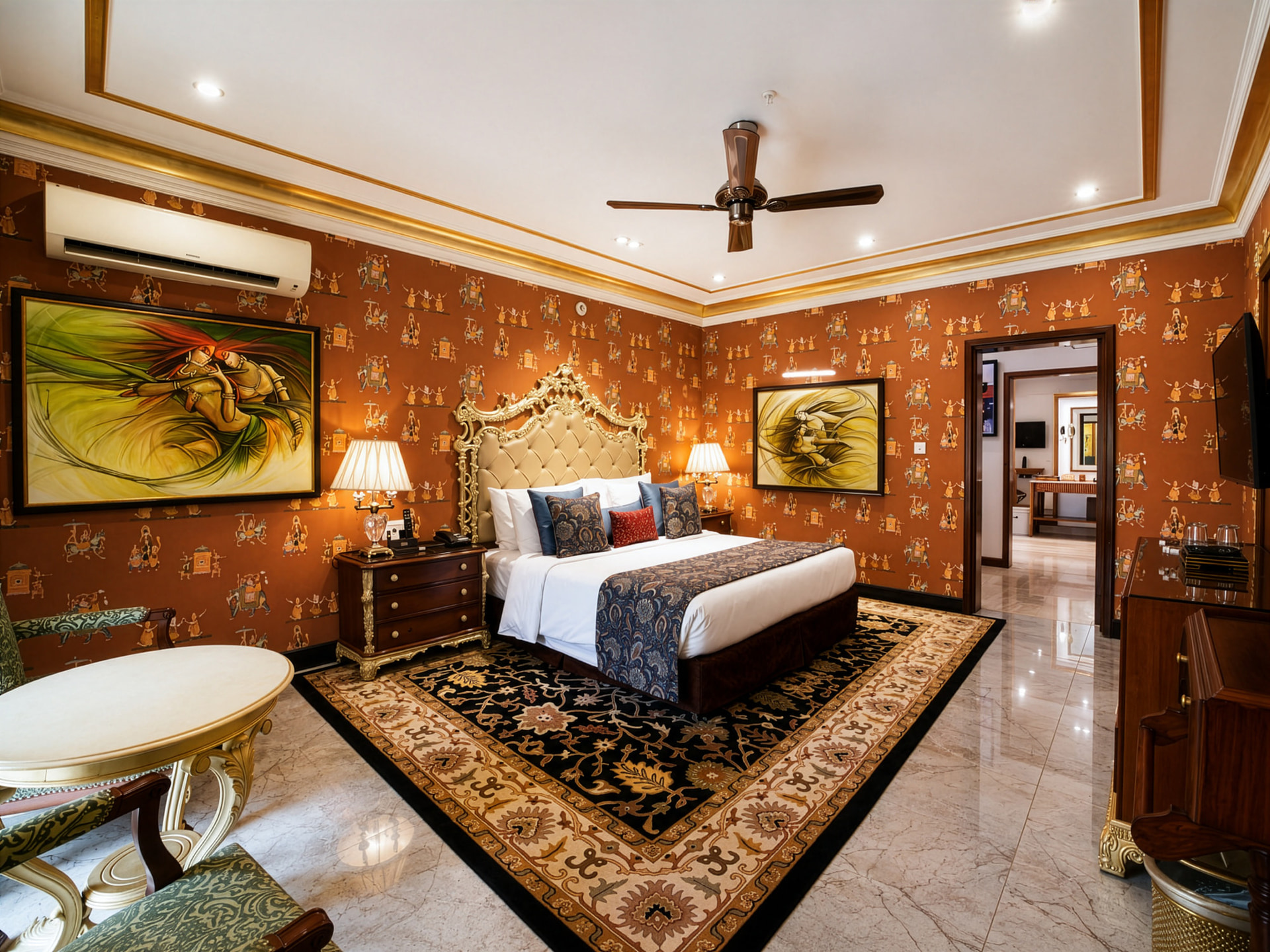 Royal Villa bedroom at Mayfair Lagoon Bhubaneswar featuring a canopied king bed, traditional wall art, chandelier, and a marble-accented seating area