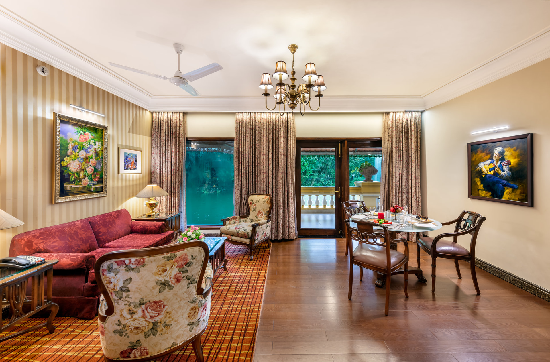 Spacious and elegantly furnished suite living room with chandelier at Mayfair Lagoon