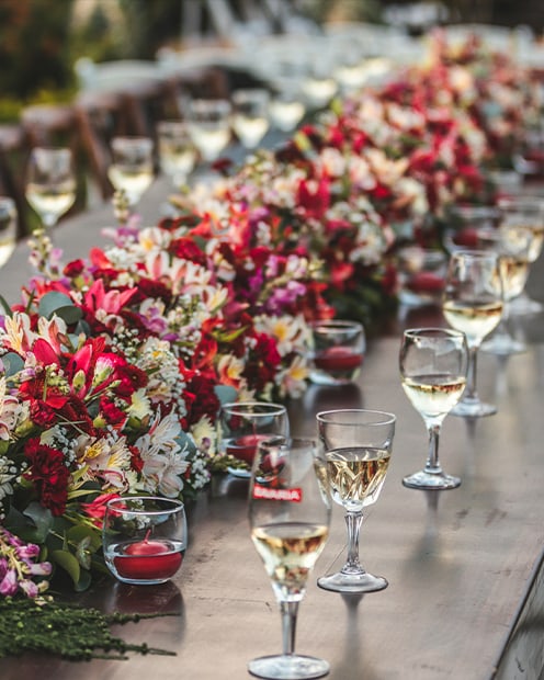 An elegant banquet table dressed with florals and crystal