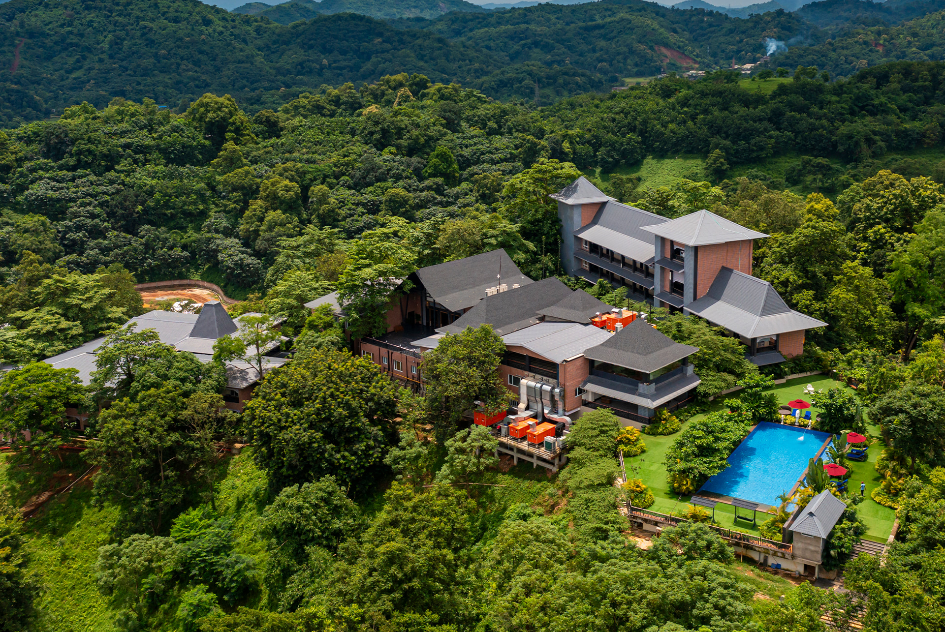 A MAYFAIR hill resort in the monsoon green, from the air