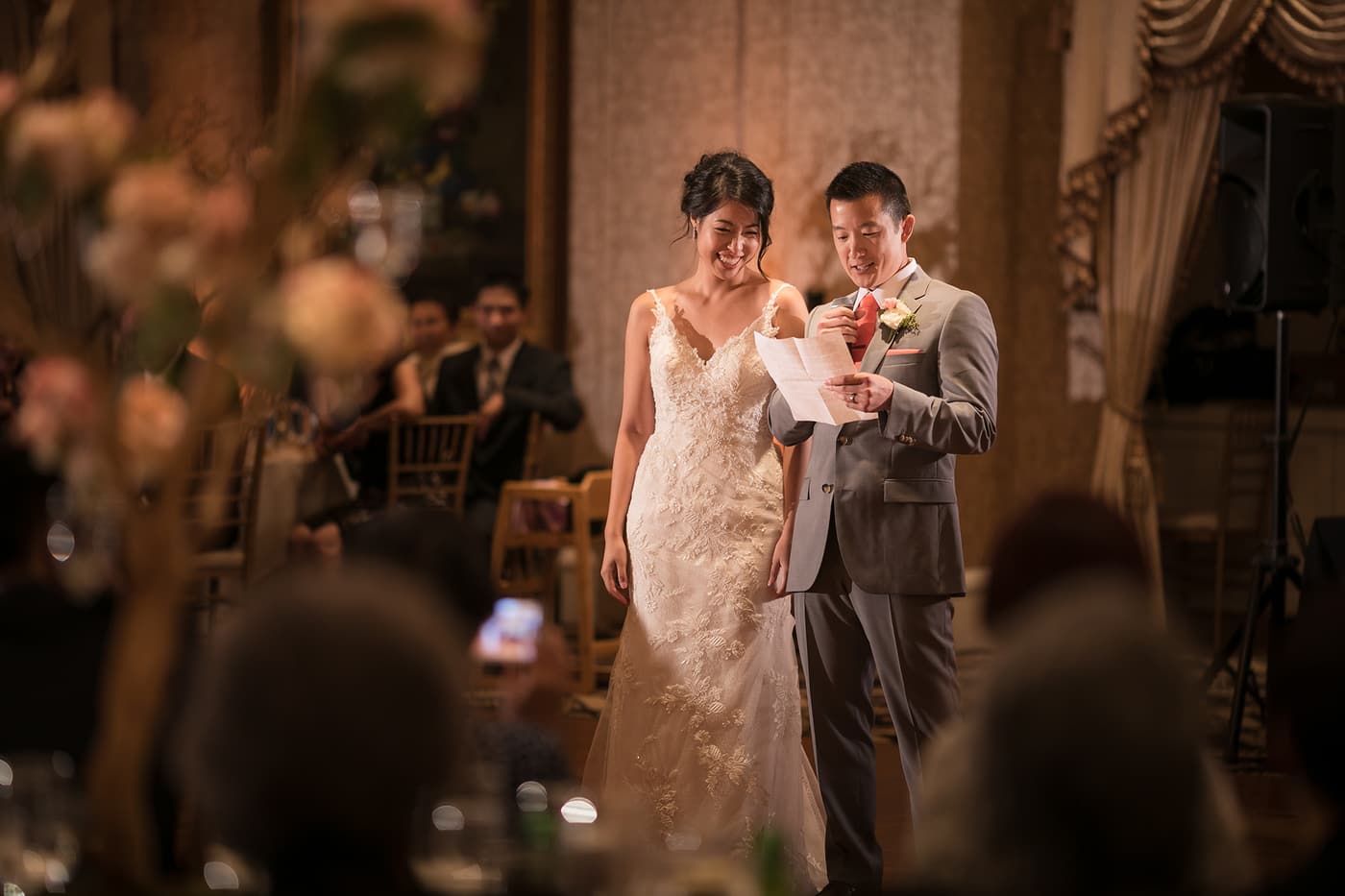 A candlelit reception table dressed with florals